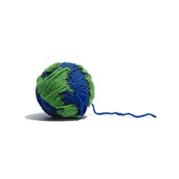 A blue ball of yarn with patches of green yarn; a model of earth.