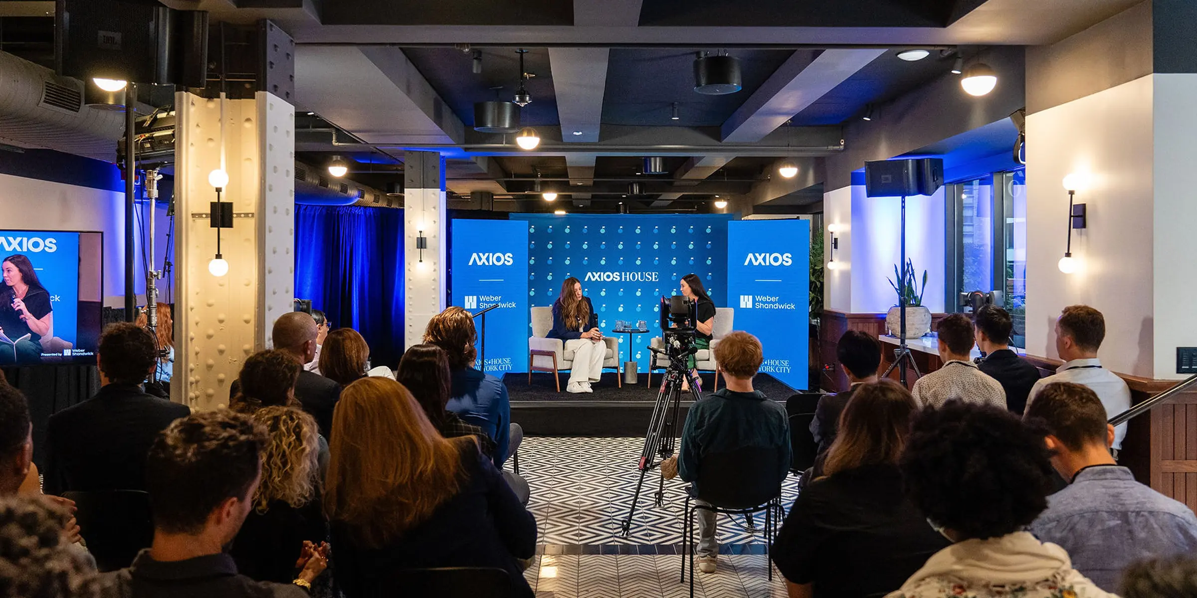 Exterior photo of an Axios Live event. The door displays 'Axios House'